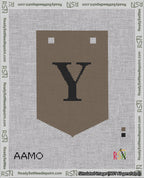 A taped needlepoint canvas with the design: Banner 18 mesh count Pointed Y Black on Brown.