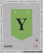 A taped needlepoint canvas with the design: Banner 18 mesh count Pointed Y Black on Light Green.