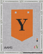 A taped needlepoint canvas with the design: Banner 18 mesh count Pointed Y Black on Orange.