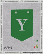 A taped needlepoint canvas with the design: Banner 18 mesh count Pointed Y White on Green.