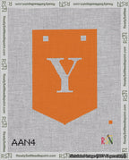 A taped needlepoint canvas with the design: Banner 18 mesh count Pointed Y White on Orange.
