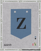 A taped needlepoint canvas with the design: Banner 18 mesh count Pointed Z Black on Blue.