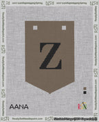 A taped needlepoint canvas with the design: Banner 18 mesh count Pointed Z Black on Brown.