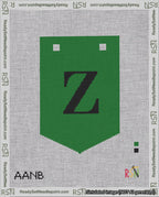 A taped needlepoint canvas with the design: Banner 18 mesh count Pointed Z Black on Green.