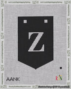 A taped needlepoint canvas with the design: Banner 18 mesh count Pointed Z White on Black.