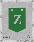 A taped needlepoint canvas with the design: Banner 18 mesh count Pointed Z White on Green.
