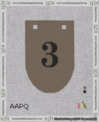 A taped needlepoint canvas with the design: Banner 18 mesh count Rounded 3 Black on Brown.