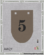 A taped needlepoint canvas with the design: Banner 18 mesh count Rounded 5 Black on Brown.
