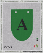 A taped needlepoint canvas with the design: Banner 18 mesh count Rounded A Black on Green.
