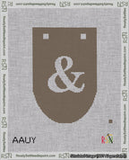 A taped needlepoint canvas with the design: Banner 18 mesh count Rounded Ampersand White on Brown.