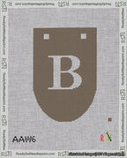 A taped needlepoint canvas with the design: Banner 18 mesh count Rounded B White on Brown.
