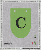A taped needlepoint canvas with the design: Banner 18 mesh count Rounded C Black on Light Green.