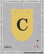 A taped needlepoint canvas with the design: Banner 18 mesh count Rounded C Black on Yellow.