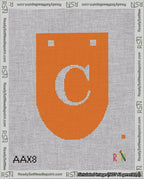 A taped needlepoint canvas with the design: Banner 18 mesh count Rounded C White on Orange.