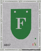 A taped needlepoint canvas with the design: Banner 18 mesh count Rounded F White on Green.