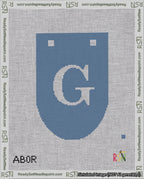 A taped needlepoint canvas with the design: Banner 18 mesh count Rounded G White on Blue.