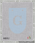 A taped needlepoint canvas with the design: Banner 18 mesh count Rounded G White on Light Blue.