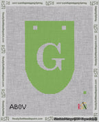 A taped needlepoint canvas with the design: Banner 18 mesh count Rounded G White on Light Green.
