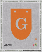 A taped needlepoint canvas with the design: Banner 18 mesh count Rounded G White on Orange.