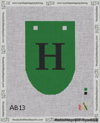 A taped needlepoint canvas with the design: Banner 18 mesh count Rounded H Black on Green.
