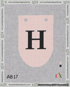 A taped needlepoint canvas with the design: Banner 18 mesh count Rounded H Black on Pink.
