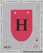 A taped needlepoint canvas with the design: Banner 18 mesh count Rounded H Black on Red.