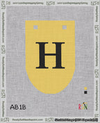 A taped needlepoint canvas with the design: Banner 18 mesh count Rounded H Black on Yellow.