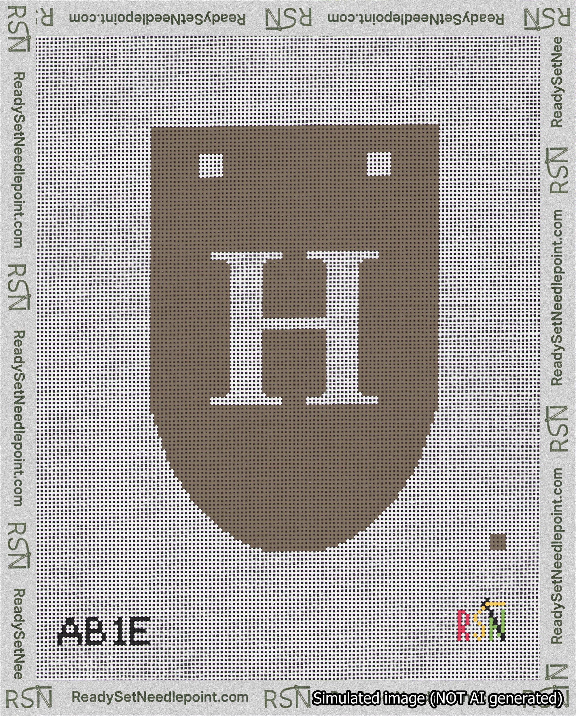 A taped needlepoint canvas with the design: Banner 18 mesh count Rounded H White on Brown.