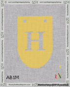 A taped needlepoint canvas with the design: Banner 18 mesh count Rounded H White on Yellow.
