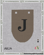 A taped needlepoint canvas with the design: Banner 18 mesh count Rounded J Black on Brown.