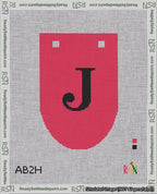 A taped needlepoint canvas with the design: Banner 18 mesh count Rounded J Black on Red.