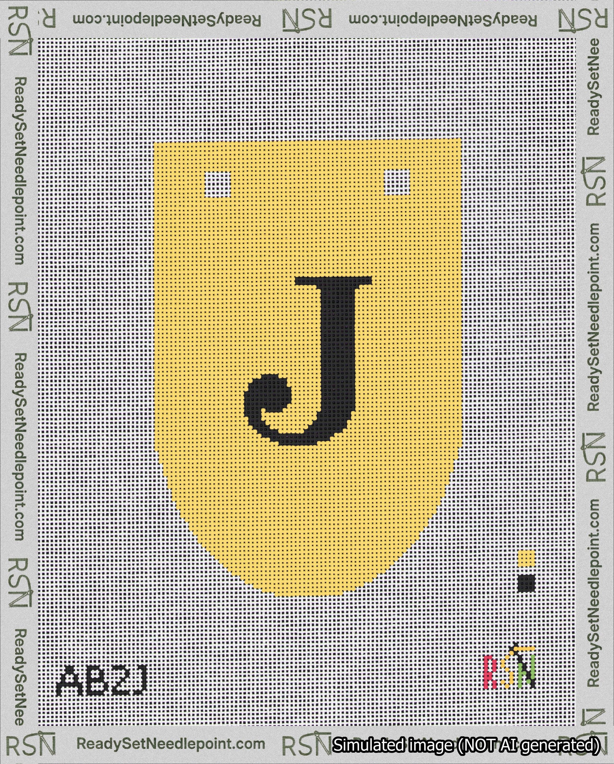 A taped needlepoint canvas with the design: Banner 18 mesh count Rounded J Black on Yellow.