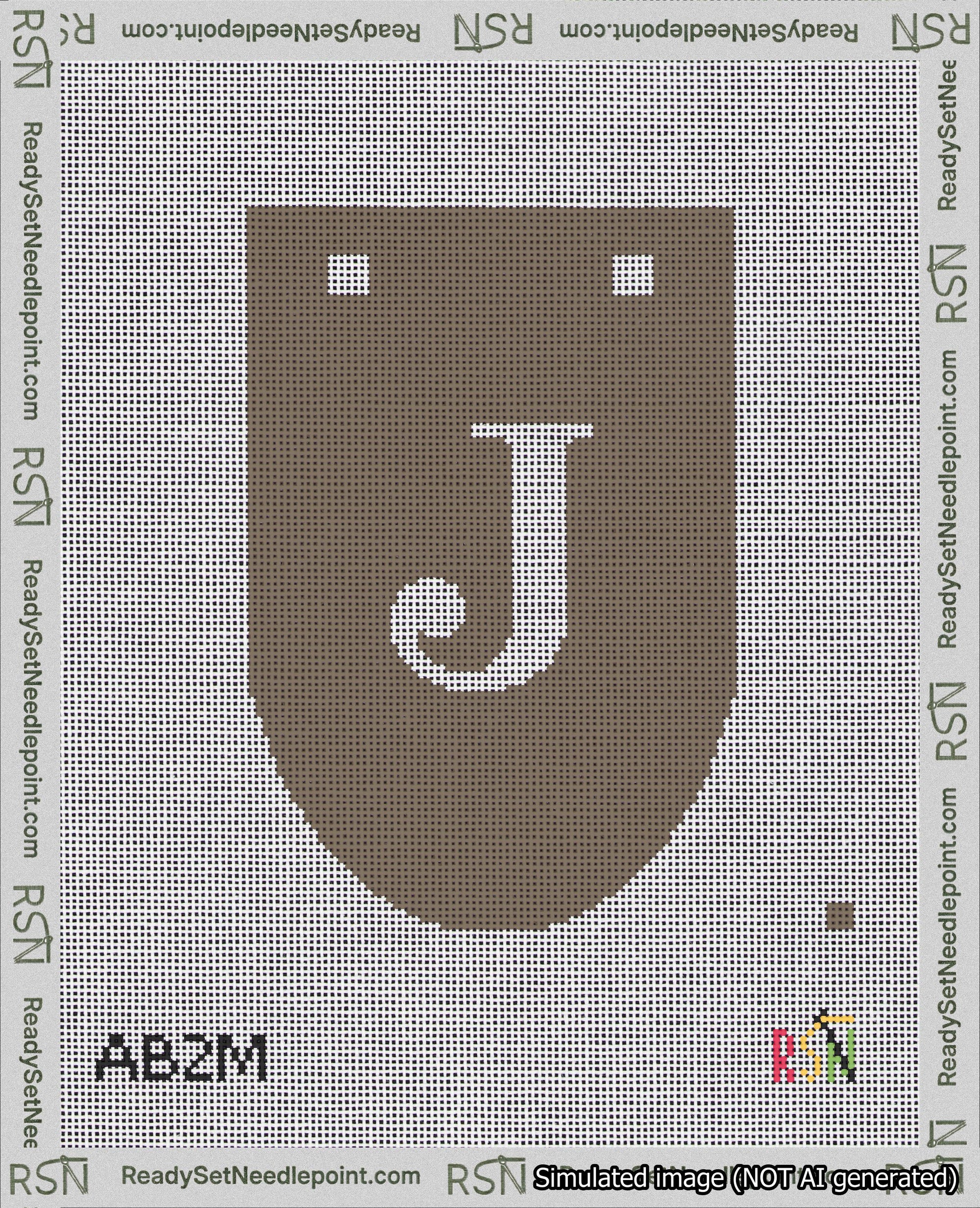 A taped needlepoint canvas with the design: Banner 18 mesh count Rounded J White on Brown.