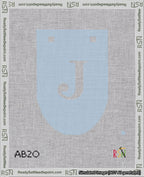 A taped needlepoint canvas with the design: Banner 18 mesh count Rounded J White on Light Blue.