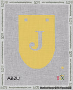 A taped needlepoint canvas with the design: Banner 18 mesh count Rounded J White on Yellow.