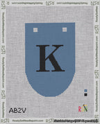 A taped needlepoint canvas with the design: Banner 18 mesh count Rounded K Black on Blue.