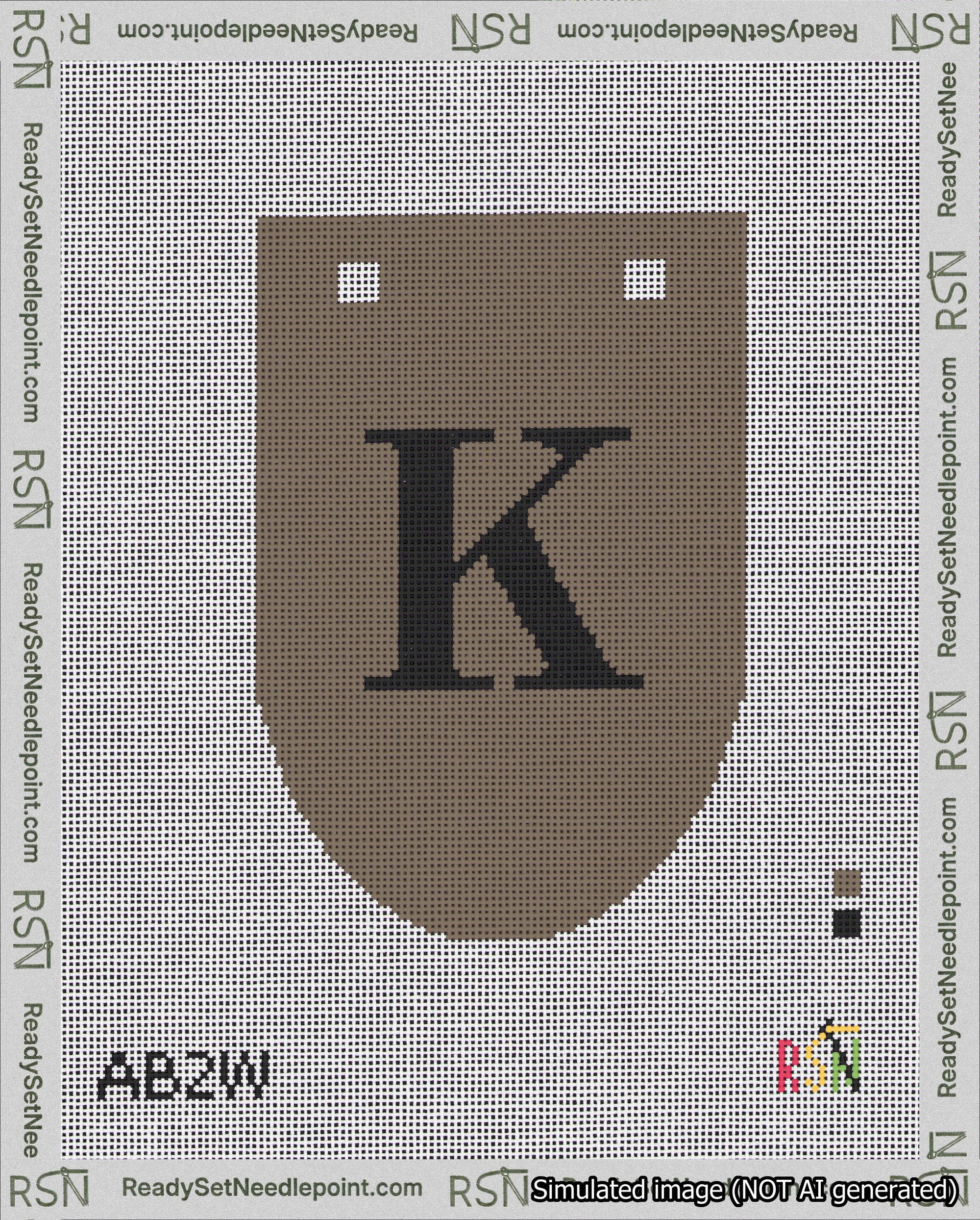 A taped needlepoint canvas with the design: Banner 18 mesh count Rounded K Black on Brown.