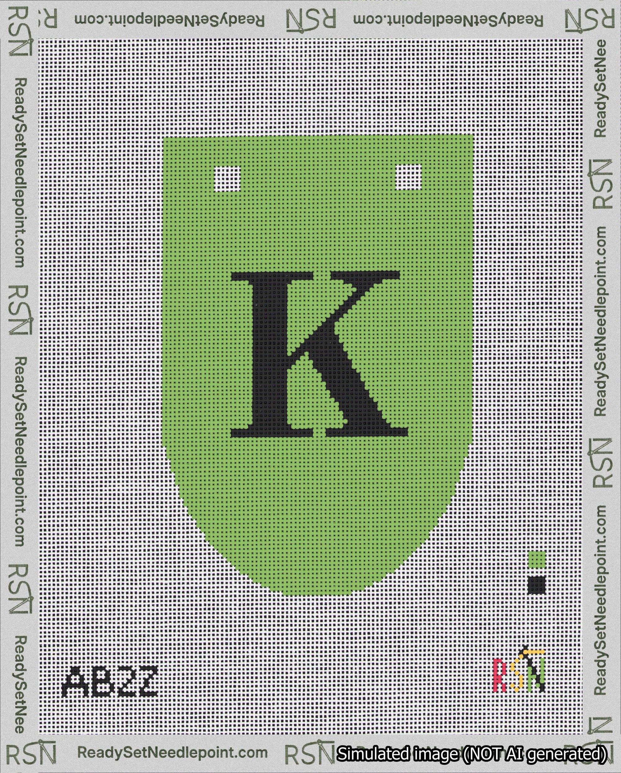 A taped needlepoint canvas with the design: Banner 18 mesh count Rounded K Black on Light Green.