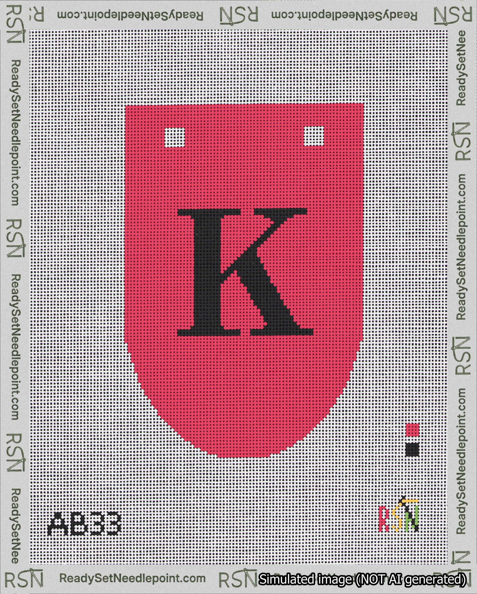 A taped needlepoint canvas with the design: Banner 18 mesh count Rounded K Black on Red.