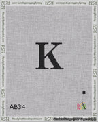 A taped needlepoint canvas with the design: Banner 18 mesh count Rounded K Black on White.