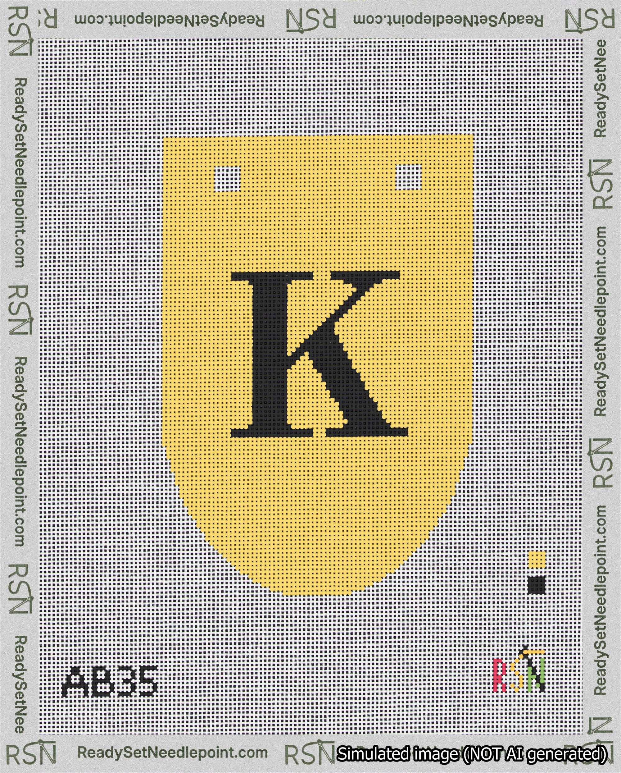 A taped needlepoint canvas with the design: Banner 18 mesh count Rounded K Black on Yellow.