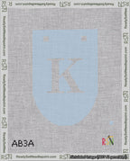 A taped needlepoint canvas with the design: Banner 18 mesh count Rounded K White on Light Blue.