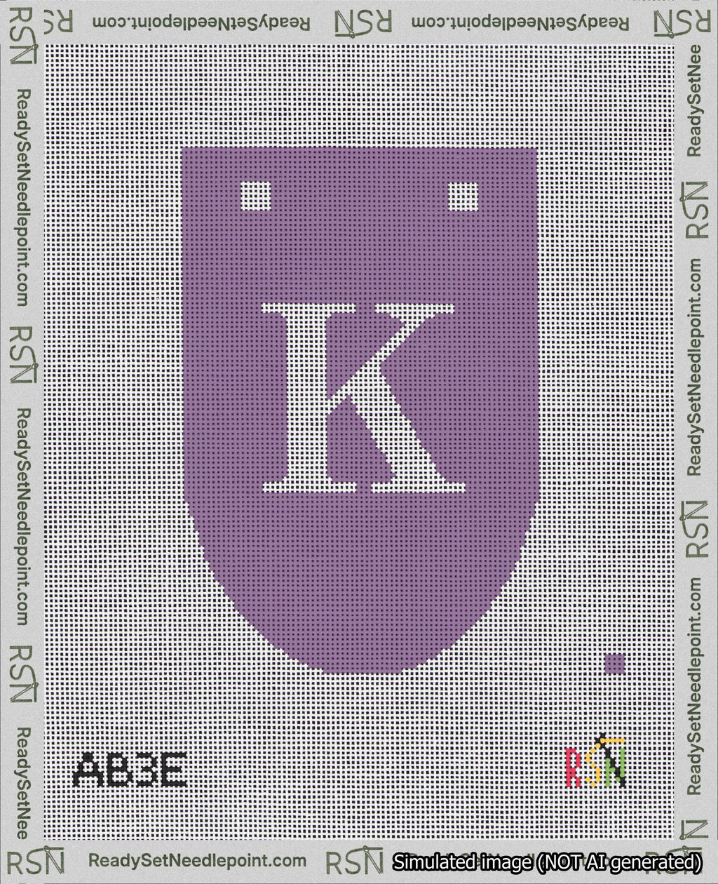 A taped needlepoint canvas with the design: Banner 18 mesh count Rounded K White on Purple.