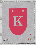 A taped needlepoint canvas with the design: Banner 18 mesh count Rounded K White on Red.