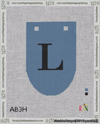 A taped needlepoint canvas with the design: Banner 18 mesh count Rounded L Black on Blue.