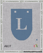 A taped needlepoint canvas with the design: Banner 18 mesh count Rounded L White on Blue.