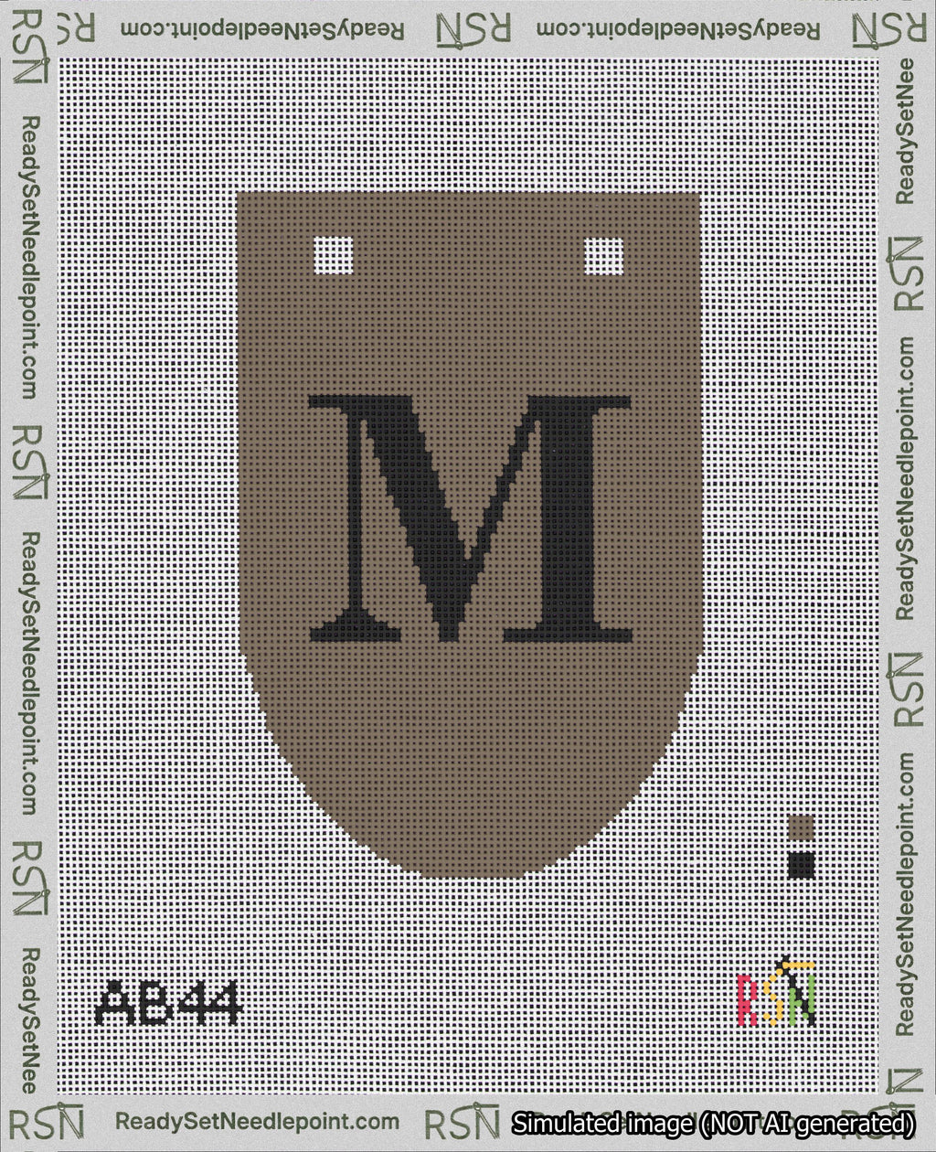 A taped needlepoint canvas with the design: Banner 18 mesh count Rounded M Black on Brown.