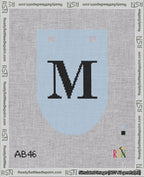 A taped needlepoint canvas with the design: Banner 18 mesh count Rounded M Black on Light Blue.