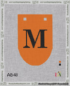 A taped needlepoint canvas with the design: Banner 18 mesh count Rounded M Black on Orange.
