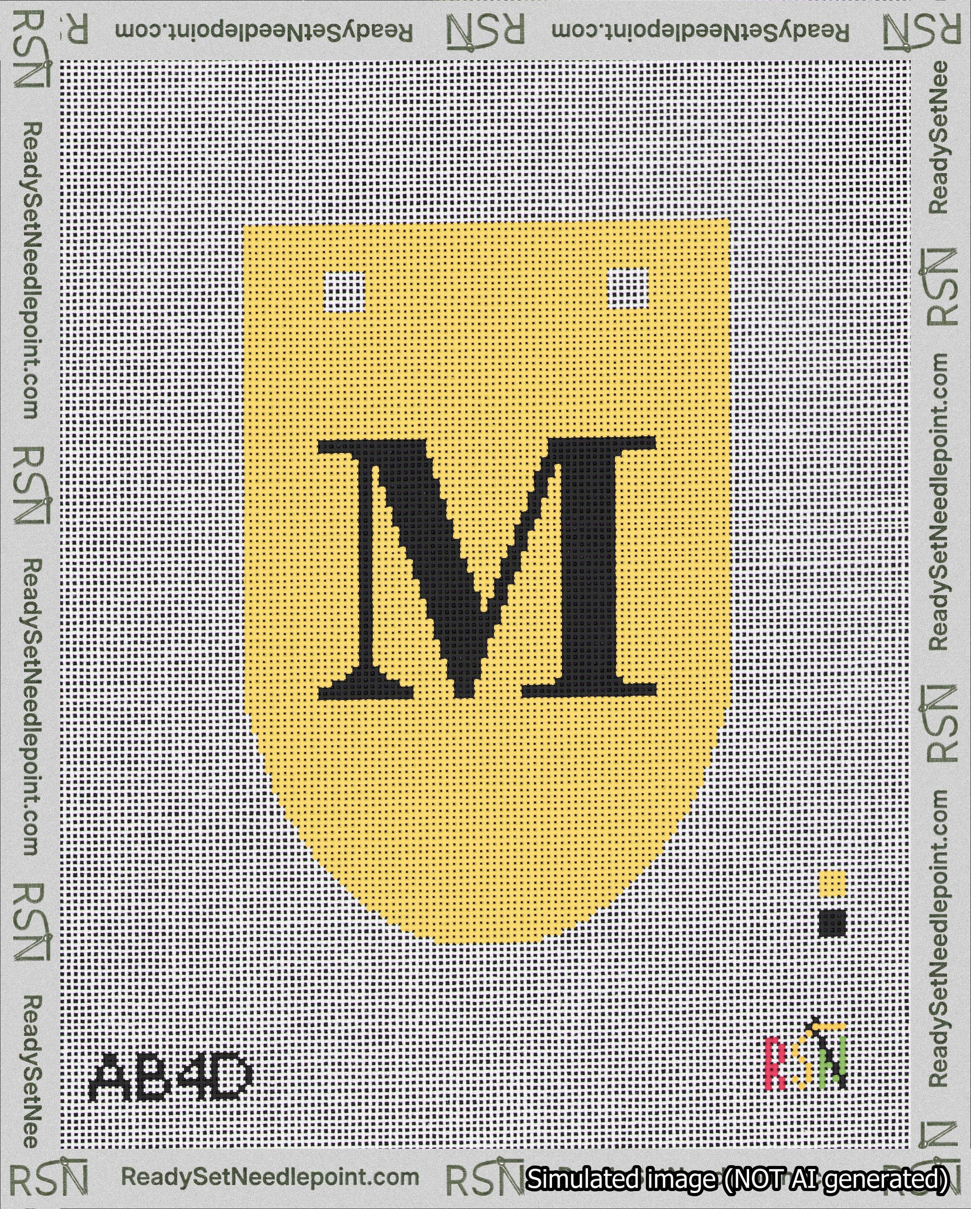 A taped needlepoint canvas with the design: Banner 18 mesh count Rounded M Black on Yellow.